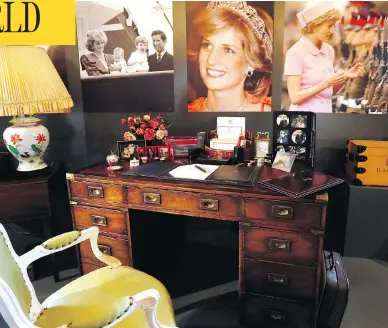  ?? KIRSTY WIGGLESWOR­TH / THE ASSOCIATED PRESS ?? A display to mark the 20th anniversar­y of the death of Princess Diana includes the desk she used at Kensington Palace to pen both official business and notes expressing her emotional turmoil after the collapse of her marriage.