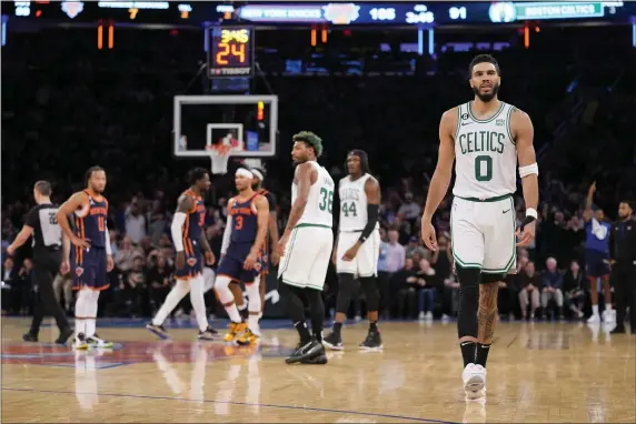  ?? JOHN MINCHILLO — THE ASSOCIATED PRESS ?? Boston Celtics forward Jayson Tatum (0) walks off the court after being ejected from the game by referee JB DeRosa (22) during the second half of an NBA basketball game against the New York Knicks, Monday, Feb. 27, 2023, in New York.