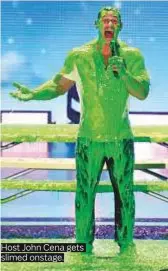  ??  ?? Host John Cena gets slimed onstage.