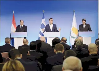  ??  ?? Greek Prime Minister Alexis Tsipras (center), Cyprus President Nicos Anastasiad­es (right) and Egyptian President Abdel Fattah el-Sisi address reporters in Elounda, Crete, after talks aimed at boosting regional stability, security and growth.