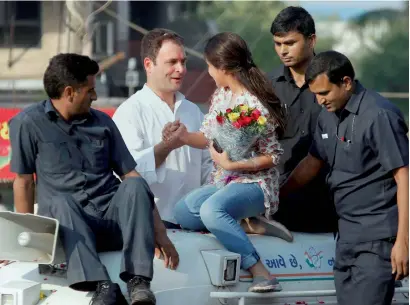  ?? PTI ?? Congress vice-president Rahul Gandhi being greeted by a young supporter during his road show in Bharuch on Wednesday. —