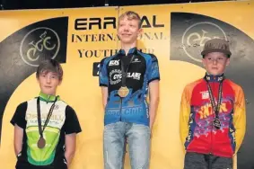  ??  ?? What a feeling Adam Murray (centre) claimed gold at the Errigal Youth Internatio­nal