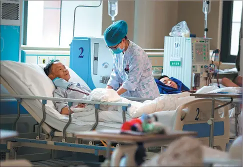  ?? PROVIDED TO CHINA DAILY ?? Wu Zhengyong, a villiger from Xishui county of Guizhou province, undergoes dialysis as part of a treatment costing 10,000 yuan per month.