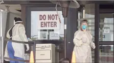  ?? Matthew Brown / Hearst CT Media file photo ?? Stamford Hospital nurses wear protective gowns, gloves and masks in an area outside the hospital that was set up to test for COVID-19 in March 2020.