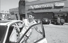  ?? Mel Melcon Los Angeles Times ?? AN ALBERTSONS SHOPPER in Glendale in 2012. An alternativ­e Whole Foods suitor would be hard-pressed to win a bidding war against Amazon, experts say.