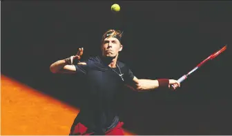  ?? CLIVE BRUNSKILL/GETTY IMAGES ?? Denis Shapovalov returns a shot en route to a 6-4, 5-7, 6-4 loss on Tuesday against Kazakhstan's Alexander Bublik, eliminatin­g the Canadian from the Mutua Madrid Open.