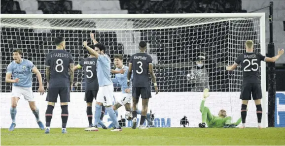  ?? (Photo: afp) ?? Manchester City’s players celebrate after scoring a goal during the UEFA Champions League first-leg semi-final football match between Paris Saint-germain and Manchester City at the Parc des Princes stadium in Paris yesterday.