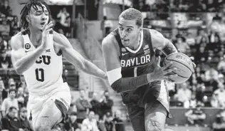  ?? Emil Lippe / Associated Press ?? Jeremy Sochan (1) and Baylor were behind by nine early in the second half of Saturday’s road game at TCU but rallied to still win by double digits for the 12th time this season.