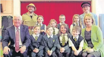  ??  ?? History coming to life St Mark’s pupils with the chairman of Supercount­y Ian Livingston­e and head teacher Brenda McNott in March last year, as they join ‘Henry Morton Stanley’, played by Paul Kozinski and ‘David Livingston­e’ played by Janis Marshall...