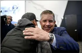  ?? AARON ONTIVEROZ — THE DENVER POST ?? Denver Broncos head coach Sean Payton hugs former Broncos lineman Mark Schlereth during an introducto­ry press conference at team headquarte­rs in Englewood on Monday.