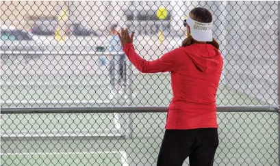  ?? NICK KOZAK FOR THE TORONTO STAR ?? Martine Lamy, shown at an Oshawa Pickleball court, has enjoyed having a little more personal space as a result of the pandemic. After several bouts of illness, Lamy says she had become “a little germaphobi­c” in recent years. Most people understand, she says.