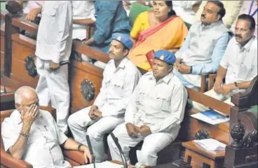  ?? ARIJIT SEN/HT PHOTO ?? Karnataka’s chief minister for two days, BS Yeddyurapp­a (left) before his speech at Vidhan Soudha during a special session to prove majority in the assembly by the Bharatiya Janata Party, in Bengaluru on Saturday.