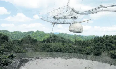  ??  ?? This July 13, 2016 photo shows one of the largest single-dish radio telescopes at the Arecibo Observator­y in Arecibo, Puerto Rico.