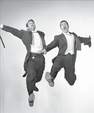  ?? John Springer Collection Corbis via Getty Images ?? ‘IT WAS PANDEMONIU­M’ Dean Martin and Jerry Lewis, right, teamed up July 25, 1946, for a show in Atlantic City, N.J. The comedic duo split up on stage July 25, 1956 — the 10th anniversar­y of their first performanc­e.