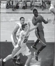  ?? MARK HUMPHREY ENTERPRISE-LEADER ?? Farmington forward Michael Ingram fights off a Wildcat defender to seize an offensive rebound. Class 7A Springdale Har-Ber defeated Class 4A Farmington, 73-45, in the season-opener on Nov. 19.