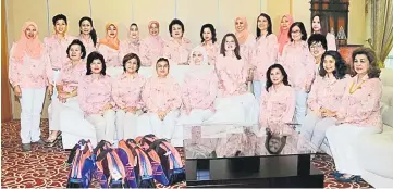  ??  ?? Juma’ani (seated fourth left) in a group photo with some of the Sabati team members at KIA before they leave for Kedah. Also seen are (seated from second left) Dayang Morliah, Doreen, Fatimah and Enn. — Photo by Penerangan.