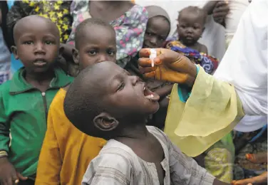  ?? Sunday Alamba / Associated Press 2016 ?? A child receives a polio vaccine last year at a camp for people displaced by militants in Maiduguri, Nigeria.