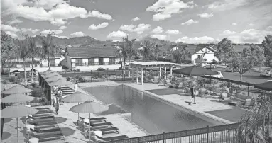  ?? PROVIDED BY CITY OF CASA GRANDE ?? An artist’s rendering shows the pool area of a planned single-family rental developmen­t in Casa Grande. Before the most recent boom in the city, it had been about 20 years since new rental housing had been built.