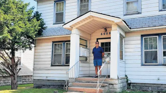  ?? JOSE ANDRADE ?? Jose Andrade, a Lake County landlord who owns 32 properties with 62 housing units, stands in front of his property in the 6600 block of Jefferson Avenue in Hammond.