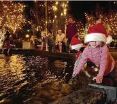  ?? Staff file photo ?? Children play in the fountain during Wassailfes­t festivitie­s in 2001 in New Braunfels.