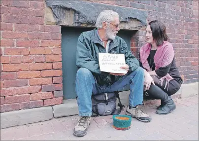  ?? JIM DAY/THE GUARDIAN ?? Filmmaker Krista Loughton, who examines homelessne­ss on a very personal level in her film, “Us & Them”, talked recently with Gary Brown while he was panhandlin­g for money in Charlottet­own to help supplement his modest income.