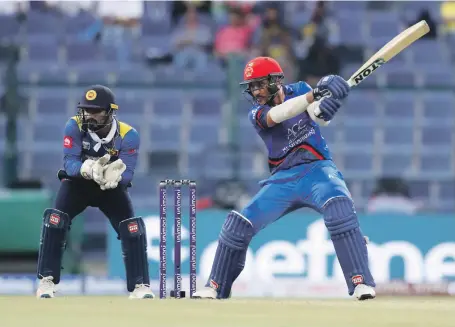  ?? Pawan Singh / The National ?? Rahmat Shah scored 72 runs for Afghanista­n as his side defeated Sri Lanka in the Asia Cup on Monday