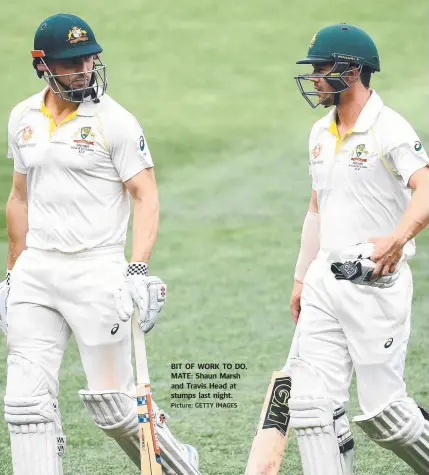  ?? Picture: GETTY IMAGES ?? BIT OF WORK TO DO, MATE: Shaun Marsh and Travis Head at stumps last night.