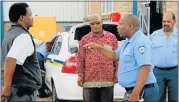  ?? Picture: FREDLIN ADRIAAN ?? STANDOFF: Provincial traffic inspector Sidwell Millie, left, gets into a argument with traffic officer Ashwell Baartman yesterday. Also present at the Kinkelbos traffic station are SA Police Union provincial secretary Eric Jinikwe, second from left,...