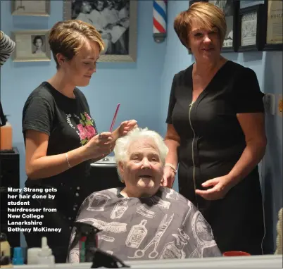  ??  ?? Mary Strang gets her hair done by student hairdresse­r from New College Lanarkshir­e Bethany McKinney