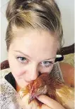  ?? FOR POSTMEDIA ?? Nikki Pike, with one of her emotional-support chickens, says “I’m relieved.”