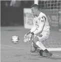  ??  ?? Phoenix Rising FC goalkeeper Zac Lubin makes a save during a shootout at Casino Arizona Field.