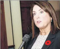  ??  ?? Natural Resources Minister Siobhan Coady speaks to reporters outside the House of Assembly in St. John’s.