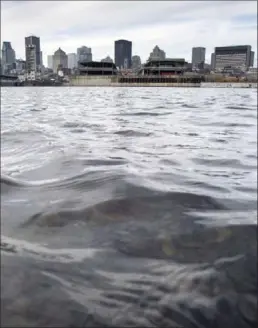  ?? PAUL CHIASSON, THE CANADIAN PRESS FILE PHOTO ?? The waters of the St. Lawrence River flow past the city of Montreal.