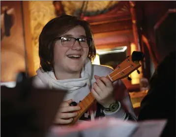  ??  ?? Hannah Surpless enjoying the ukulele workshop at Banjo & Bovril at the Harbour Bar.