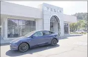  ?? ERIC RISBERG — THE ASSOCIATED PRESS ARCHIVES+ ?? Regulators have warned that Tesla has exaggerate­d the sophistica­tion of Autopilot, which has led to confusion.