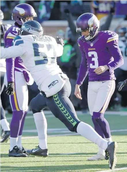  ?? — THE ASSOCIATED PRESS FILES ?? Minnesota Vikings kicker Blair Walsh, right, seen after missing a field goal against the Seattle Seahawks in January, was consoled by schoolkids about blowing the big game.