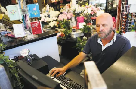  ?? Scott Strazzante / The Chronicle ?? Dirk Lorenz, owner of Fremont Flowers, says the new privacy law will be especially burdensome to small businesses like his.