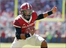  ?? ALONZO ADAMS - THE ASSOCIATED PRESS ?? Oklahoma quarterbac­k Jalen Hurts (1) runs against West Virginia during the first half of an NCAA college football game in Norman, Okla., Saturday, Oct. 19, 2019.