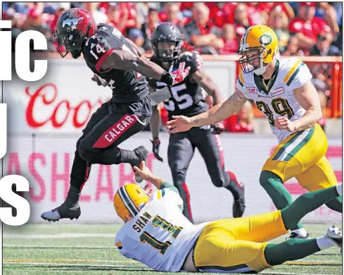  ?? GAVIN YOUNG/POSTMEDIA FILES ?? Stampeders’ Roy Finch runs for a touchdown after a fumbled Eskimos kick return during their Labour Day Classic matchup last year in Calgary. The teams are 25-25-1 in the yearly showdown.