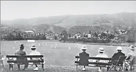  ?? GETTY ?? Spectators watch a cricket match in Shillong, then part of Assam, in 1900.