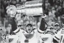  ?? Patrick Smith / Getty Images ?? Like the Capitals the year before, the Blues used a rugged style of play to lift the Stanley Cup last season.