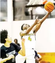  ??  ?? Coltie Young (4) looks to score on a layup for Starkville against Olive Branch on Saturday night. (Photo by Jeremy Miller, for Starkville Daily News)