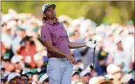  ?? David Cannon / Getty Images ?? Cameron Smith reacts to his shot from the 12th tee during Sunday’s final round of the Masters.