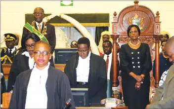 ??  ?? President Mugabe and First Lady Amai Grace Mugabe stand for the National Anthem during the official opening of the Fifth Session of the Eighth Parliament in Harare yesterday