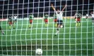  ?? ?? Gary Lineker scores a penalty against Cameroon at Italia 90. ‘We changed the perception of football. It wasn’t just a working man’s sport any more’. Photograph: