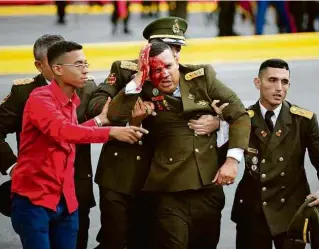  ?? 14.ago.17/Xinhua ?? Venezuelan­o sangra após suposta tentativa de ataque de drone contra Maduro