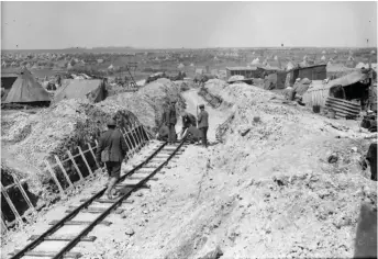  ?? Photo: Canada. Dept. of National Defence / Library and Archives Canada ?? Canadian railway workers build a railroad through captured territory during the Battle of Vimy Ridge in April 1917.