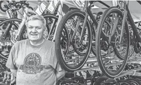  ?? SCOTT ASH / NOW NEWS GROUP ?? John Jensen, owner of Johnson's Cycle & Fitness in Wauwatosa, is pictured in his store on Thursday. The business has seen a tremendous increase in both sales and service due to the coronaviru­s pandemic.