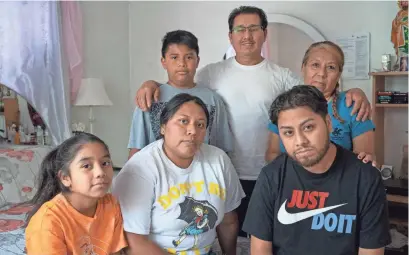  ?? PHOTOS BY MICHELLE HANKS/USA TODAY ?? After 11 months in the hospital with COVID-19, Edwin “Avi” Luna, bottom right, continued to suffer its ravages. His lungs were scarred so badly he would need new ones to survive. He’s seen here with his wife, Mayra; their children, Gabriella and Andrew; and Edwin’s parents, Felipe Luna and Celestina Vivar.