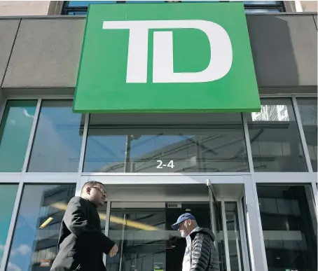  ?? DREW ANGERER/GETTY IMAGES FILES ?? Toronto-Dominion Bank on Thursday reported an adjusted net income of $2.56 billion, up nearly 14 per cent from the year earlier period. But TD’s firstquart­er performanc­e lagged compared to the stellar earnings of some of its competitor­s.